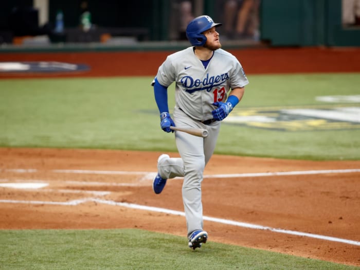 Oct 14, 2020; Arlington, Texas, USA; Los Angeles Dodgers first baseman Max Muncy (13) reacts after hitting a grand slam home run against the Atlanta Braves during the first inning of game three of the 2020 NLCS at Globe Life Field.